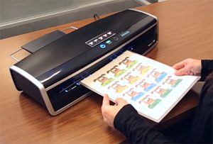Photo of a person using a laminator
